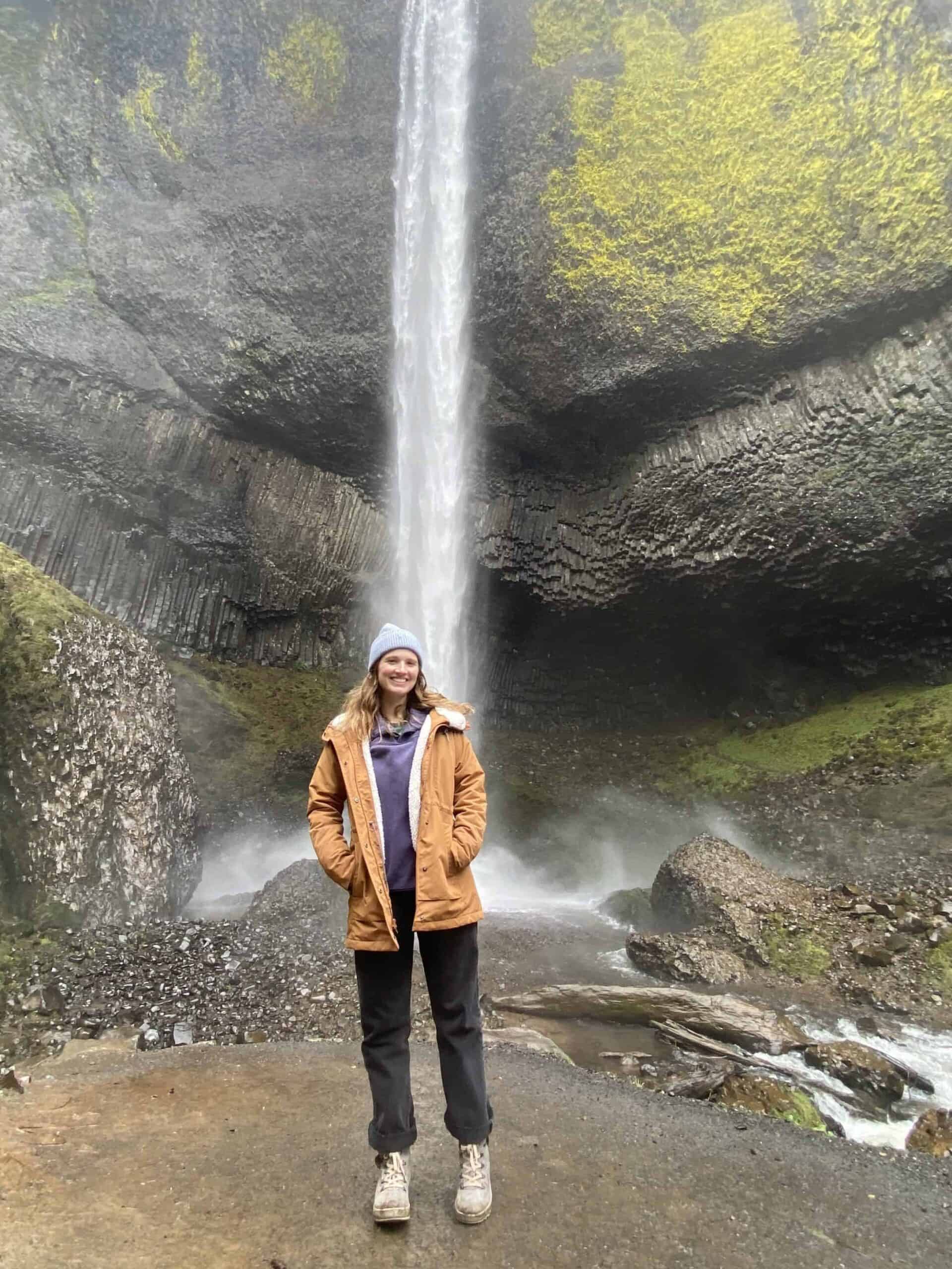 Mariah in front of a Waterfall