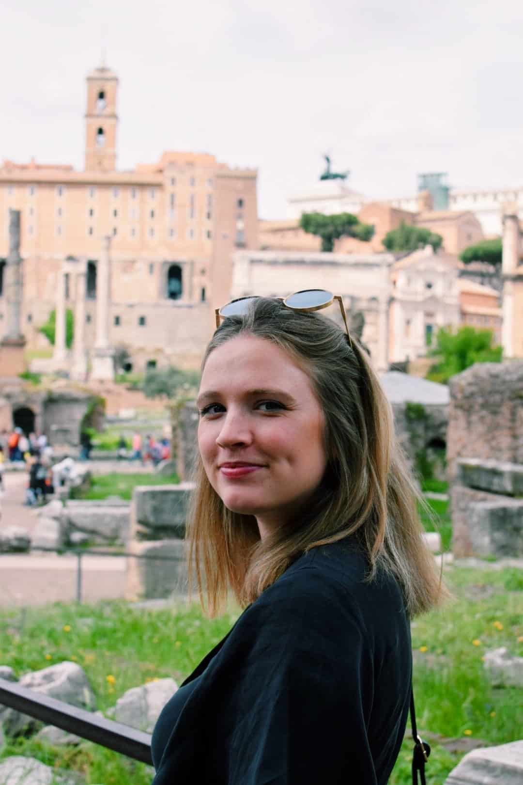 Mariah posing in front of ruins in Rome, Italy